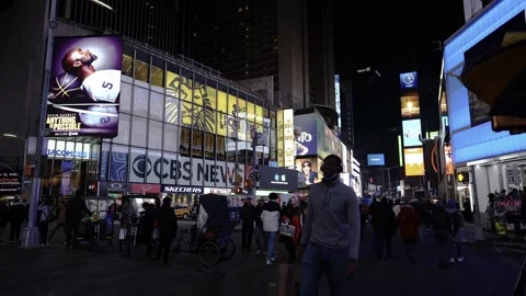 Times Square, busy tourist intersection of neon art and commerce Stock Footage 200218127