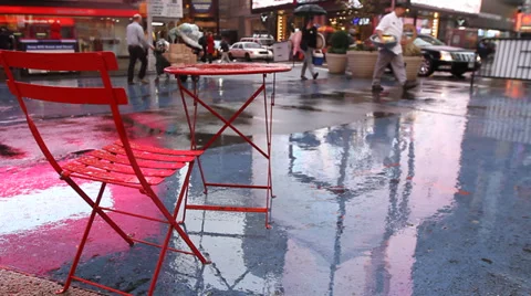 Times Square, New York, empty red chair and table, rain Stock Footage 32942700