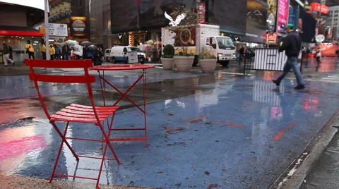Times Square, New York, empty red chair and table, rain Stock Footage 32958614