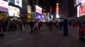 Times Square at night in 4K with people costumed in the Statue of Liberty 4k or 4k+ Resolution