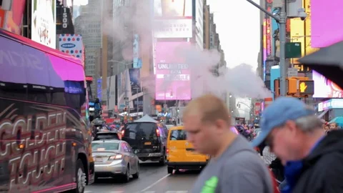 Times Square NYC Evening Diverse People Walking Steam Traffic Jam Raining Day Stock Footage