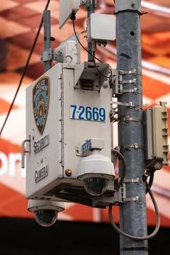 Times Square security camera pole with NYPD equipment Stock Photos
