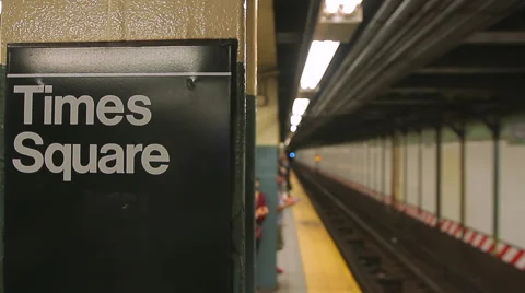Times Square subway platform, train arrives and passengers exit Stock Footage 58180287