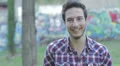 timid man laughing and looking at the camera HD Footage