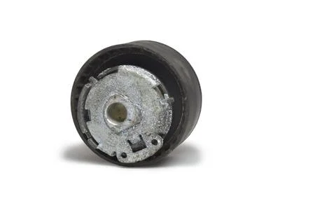 Timing belt tensioner roller, threadbare, with white cover of corrosion fla.. Stock Photos
