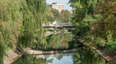 Timisoara. Bega river. Car traffic over Decebal Bridge. Water reflection. Stock Footage 61745135