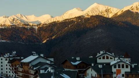 Timlaps sunset over the buildings of the Rose Plateau in Sochi, mountain ski res Stock Footage 93293017