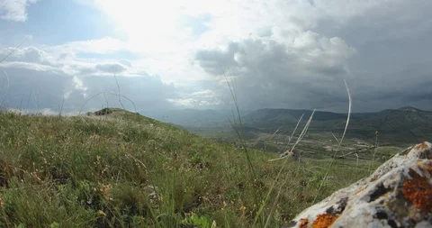 Timlapse clouds over the hills cover the sun Stock Footage 91402274