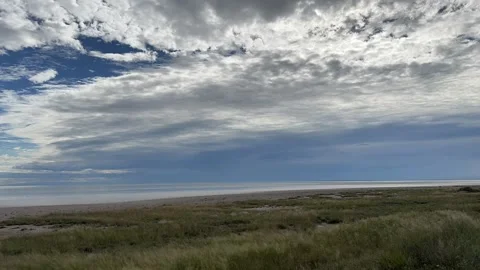 Timlapse of moving clouds over Etosha pan after rain Stock Footage 334939477