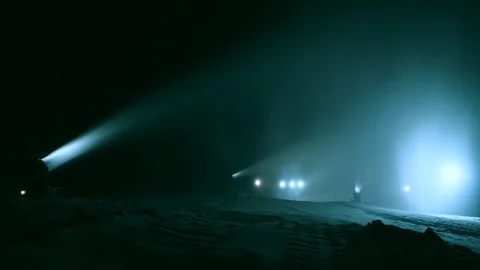 Timlipse of Snow making system. A snow cannon sprays water and makes snow Stock Footage 124278063