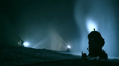 Timlipse of Snow making system. A snow cannon sprays water and makes snow Stock Footage 124278114
