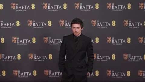 Timothee Chalamet and Emma Stone arrive at the Bafta film awards Video stock 329436542