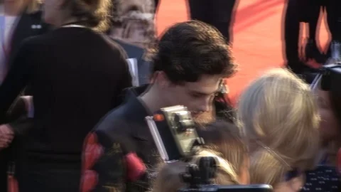 Timothee Chalamet giving autographs to his fans at BFI London Film Festival 2018 Stock Footage 101190844
