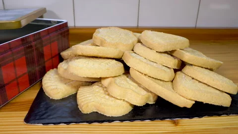 A tin box of Scottish shortbread assortment, in a pile. Stock-Footage 169921883