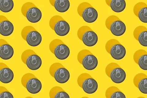 Tin can pattern top view on yellow background with hard shadow. The concept Stock-Fotos