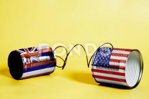 Tin can phone with USA and Hawaii U.S. state Flags.communication concept Stock Photos