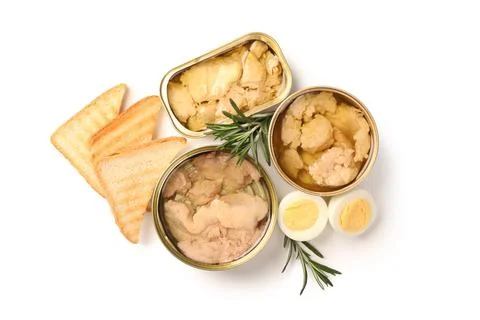 Tin cans with tasty cod liver, rosemary and bread isolated on white backgroun Stock Photos