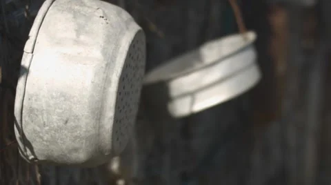 Tin Containers hand on a straw wall Stock Footage 62450909