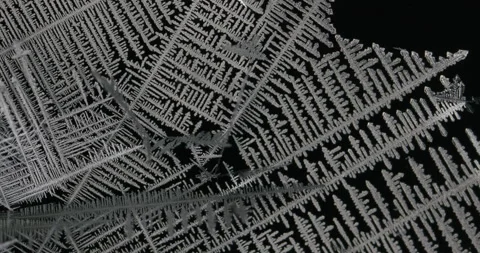 Tin metal element forming process under microscopy 4k timelapse video Stock Footage 116792063