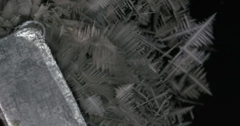 Tin metal element forming process under microscopy 4k timelapse video Stock Footage 116792423