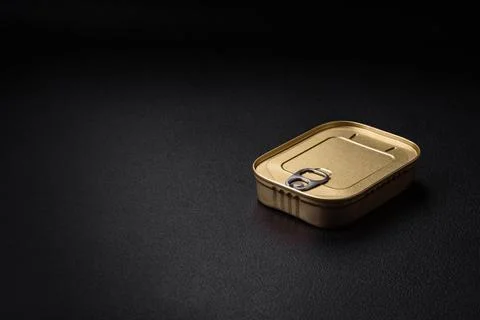 Tin or aluminum rectangular can of canned food with a key 스톡 사진