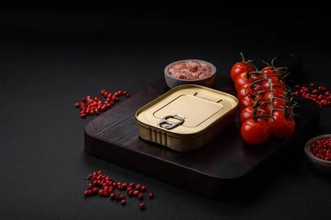 Tin or aluminum rectangular can of canned food with a key 스톡 사진