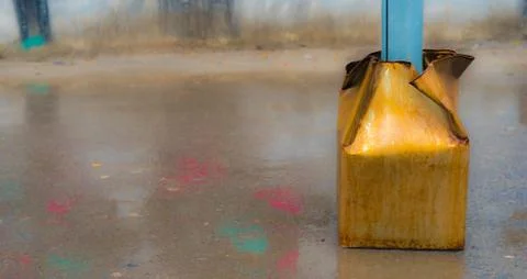 The tin panel of a piler and a puddle Foto stock