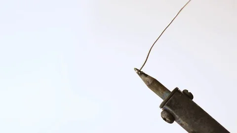 Tin soldering iron on the white background fhd Stock Footage 93716063