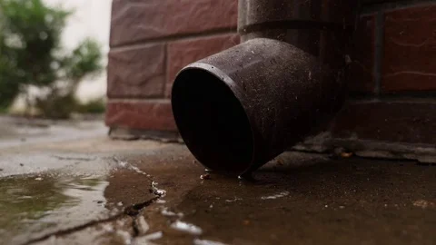 Tin water run drain pipe and water drops fall . Rain water gathering Stock Footage 83790050