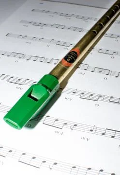 Tin whistle and note sheet Stock Photos