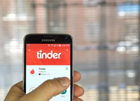 Tinder application on Android phone Stock Photos