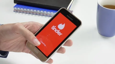 The Tinder application is loaded for a very long time Stock Footage 99834972