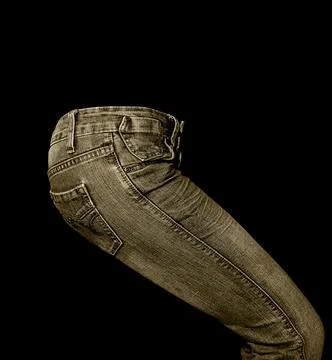 Tint jeans in front of black background Stock Photos