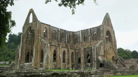 Tintern Abbey framed by trees. Establishing shot. Stock Footage 147160480