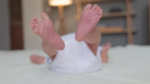 Tiny babies feet on white blanket small bare feet of baby infant sleeping on Видео 291417933