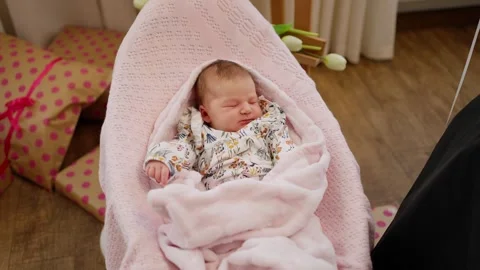A tiny baby sleeps in a cradle Stock-Footage 244209516