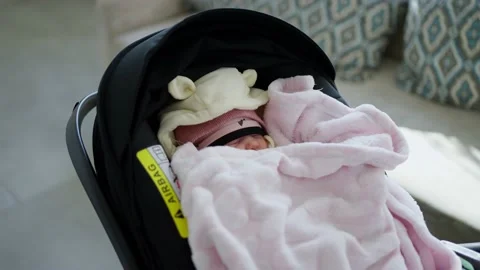 A tiny baby sleeps in a stroller on a walk Video stock 238529643