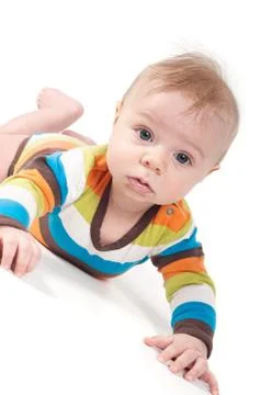 Tiny baby in striped clothes Stock Photos