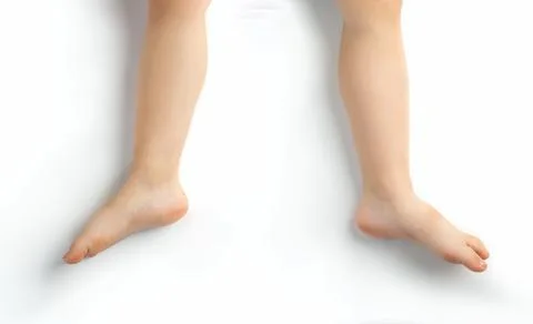 Tiny baby's cute feet isolated on white background . Stock Photos