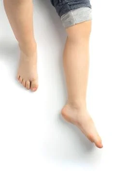 Tiny baby's cute feet isolated on white background . Stock Photos