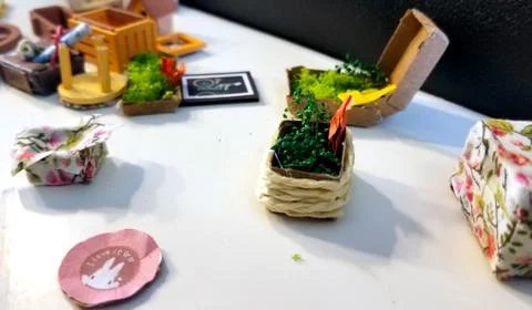 Tiny basket of flowers Stock Photos