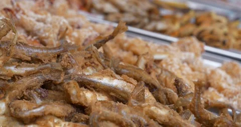 Tiny battered and fried fish. Small fried fish in batter in supermarket Video stock 282660567