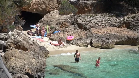 Tiny beach with turquoise water Stock Footage 128348424