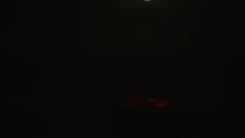 Tiny black box with ribbon. Retro light bulb under gift box. Ideas for presents. Stock Footage 124975085