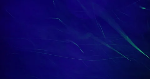 Tiny Blue Particles Whirling Against Purple Bokeh 库存影片 275852851