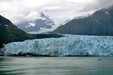 Tiny boat and glacier Stock Photos