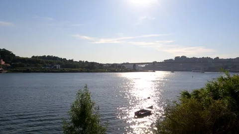 Tiny Boat on a Sunset River Stock Footage 280403743