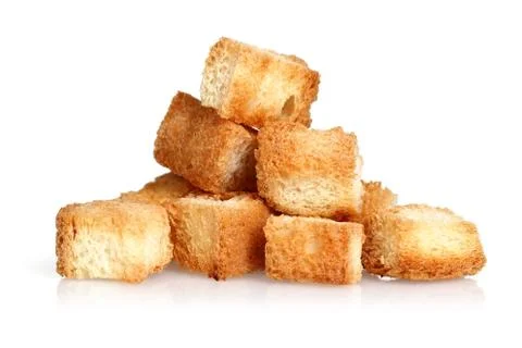 Tiny bread cubes on white background Stock Photos