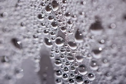 Tiny Bubbles on a Colour Background Condensation Steam Water Foto stock