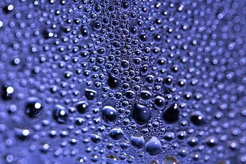 Tiny Bubbles on a Colour Background Condensation Blue Steam Water Foto stock